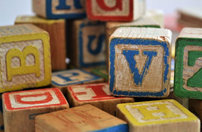 A pile of wood alphabet blocks